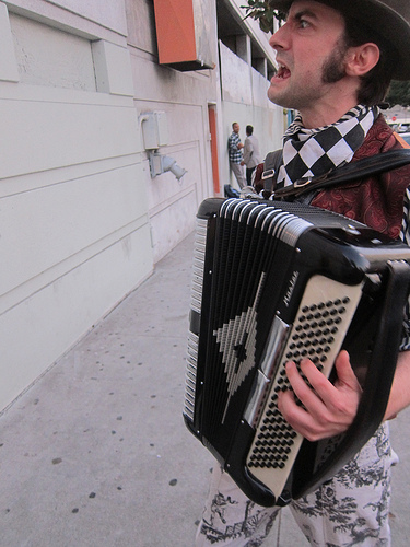 accordion player welcomes all